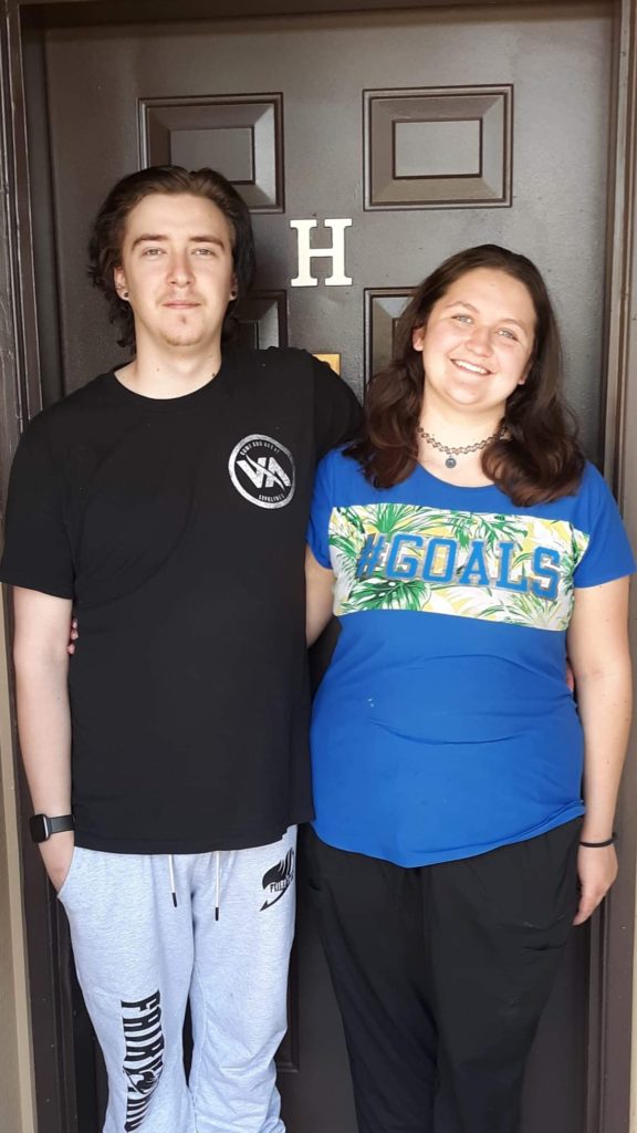 My husband and I standing in front of the door of our first apartment. I was looking forward to finding myself in my 20s.